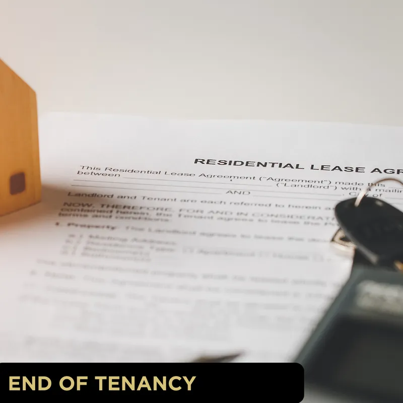 Lease document beside a wooden house model and keys, illustrating end of tenancy cleans and property preparation in York